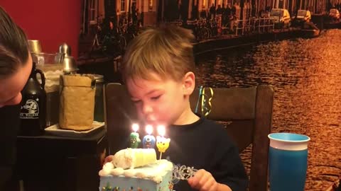 Kid Doesn't Understand Concept Of Blowing Out Birthday Candles