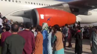 Afghans Overrun Airport in Hopes of Survival