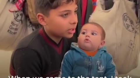 This Palestinian child has been taking care of his baby sister after their mother was killed