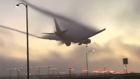 The plane came out of the cloud