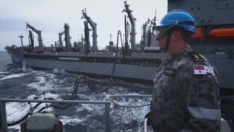 Royal Australian Navy Ships Conduct Replenishment At Sea With US Navy