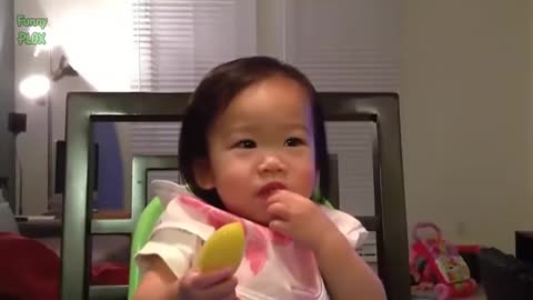 Babies eating lemon first time