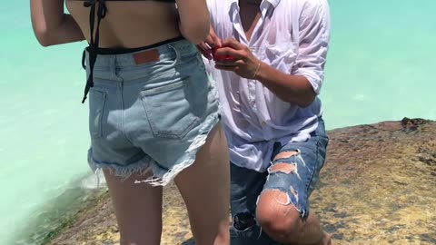 Guy Slips and Falls Into Water While Trying to Propose
