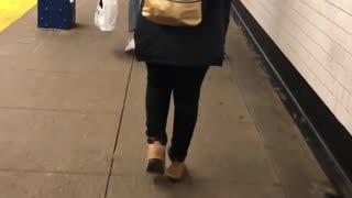 Woman carries a backpack that says "i want pizza, not your opinion"