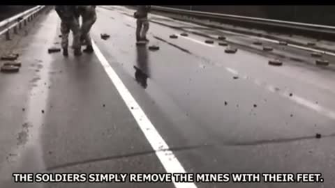 Ukrainian soldiers remove minefield with their feet