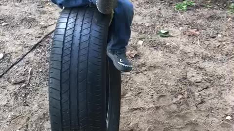 Ashers first swing on tire swing