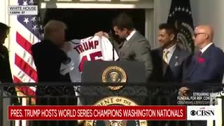 Nat's Ryan Zimmerman presents President Trump a personalized jersey.