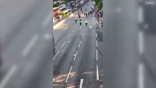 Hong Kong motorcycle cop aggressively charging protesters
