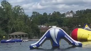 Girl Catches Massive Air from Fat Boy Float at Water Park