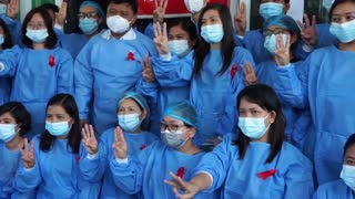 Myanmar medics wear red ribbons in coup protest