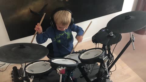 Boy playing Drum