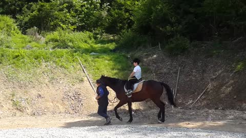 riding a child's horse