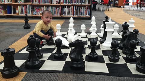 little one playing big chess