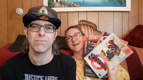 Showing my haul of DC Comics Trade Paperbacks from Ollie's Bargain Outlet to my girlfriend Laura