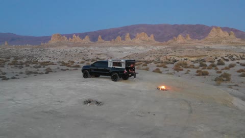 Man and a Car in the Middle of the Desert