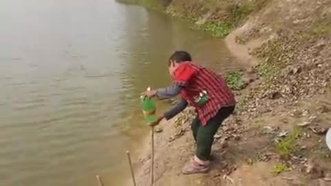 Traditional Small Boy Catching Fish