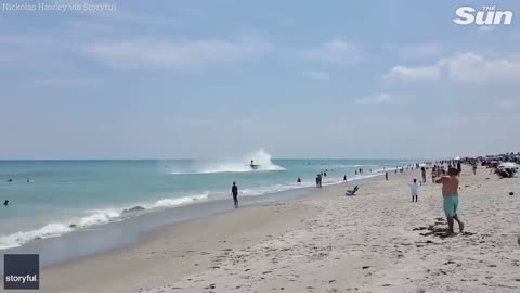 Plane crash lands in the sea close to busy beach during Florida Air Show