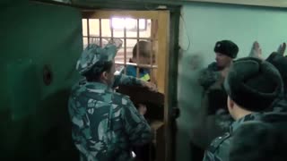 Russian Prison Guards Filmed Punching Inmates