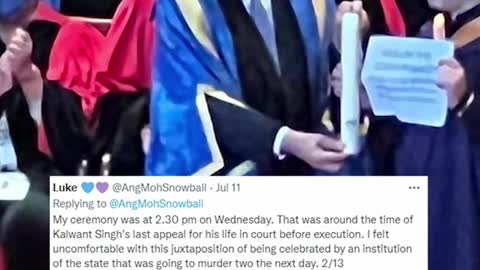 NUS student holds 'abolish death penalty' sign during grad ceremony