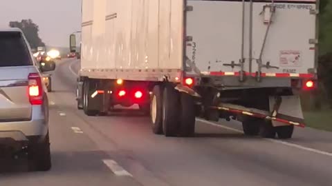 Truck with Broken Trailer Driving on Interstate