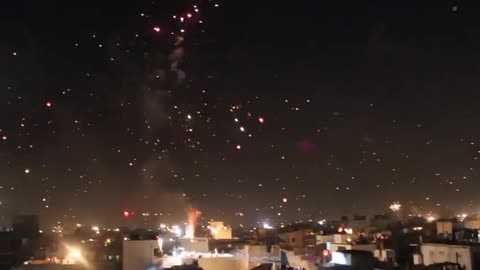 Beautiful lanterns and fire crackers in the sky at night