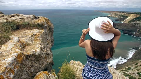 Tourist looking at the beach scenery from above