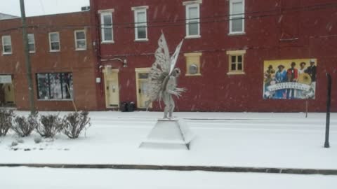 A Snowy Morning at the Mothman Statue