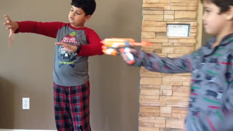 Baby Brother Ruins Kid's Cool Card Trick With Nerf Gun