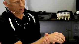 Squeeze wrist to relieve pain