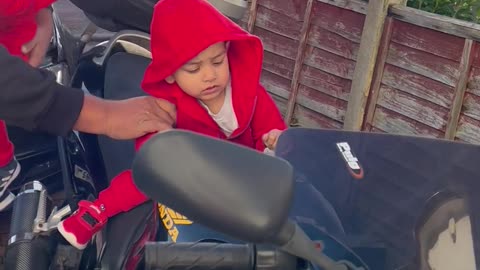 Baby karim’s sitting on the bike 🏍️ with Daddy