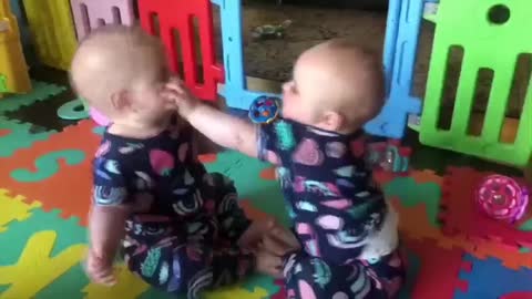 cute twins fight over nothing