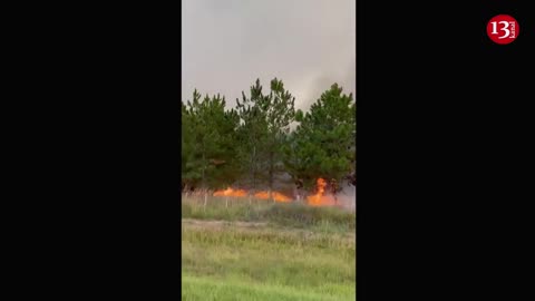 Authorities work to tame large wildfire raging in northeast Argentina