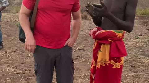 Man Shows Bodi Tribesman Picture of Snow for First Time