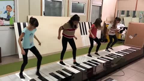 Rock by baby piano dancers