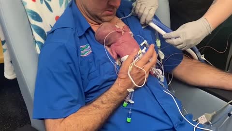 New Parents Hold Their Baby for the First Time