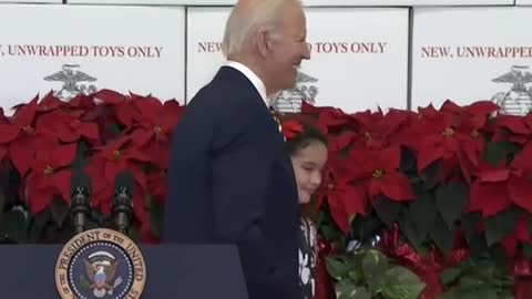 Biden directed offstage by child after remarks