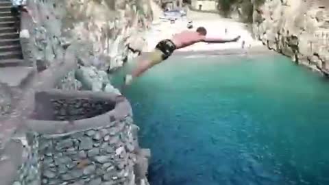 He is not afraid of jumping into the water at such a high altitude.