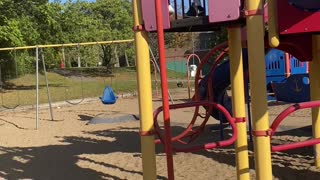 Kiddo Jumps Down Pole at Park Inside of Sliding Down It