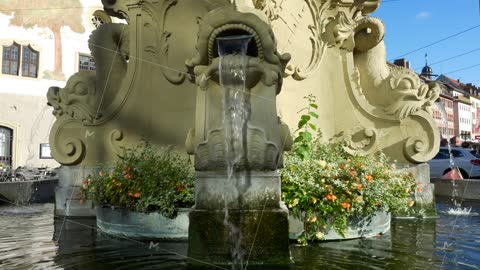 Four-pipe fountain of the 18th century in the style of the Wuerzburg Baroque.