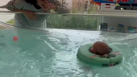 Baby learns to swim