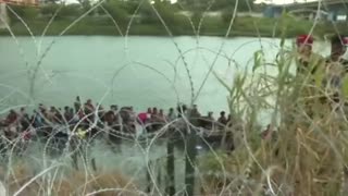 Illegal Aliens force children to crawl under razor wire at Eagle Pass.