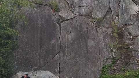 Mountain Biker Rides Vertical Rock Wall