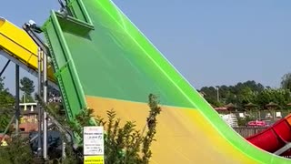 Guy Wipes Out on Innertube Slide