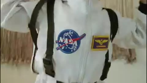 portrait of a little girl jumping on NASA
