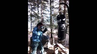 Punching the hell out of a stinking outdoor heavybag
