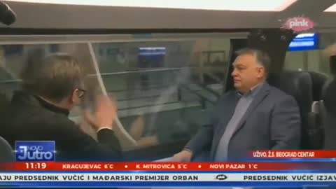 In the video, the Serbian president waves his hand through the train window.