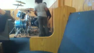 Kid Plays drums