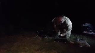 Setting up the portable fire pit to make a campfire. Riverside wildcamping. Aug 2022