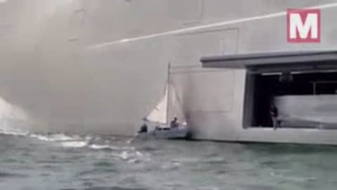 Frantic family in tiny boat crash into Russian tycoon’s gigantic £360m superyacht