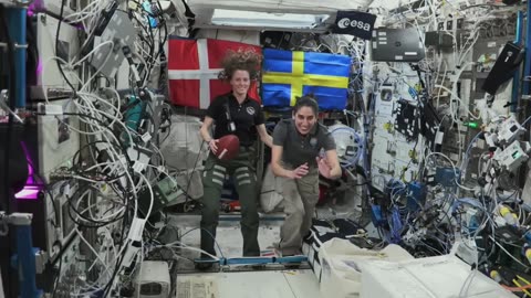 NASA Astronauts Abroad Space Station Huddle up for Super Bowl